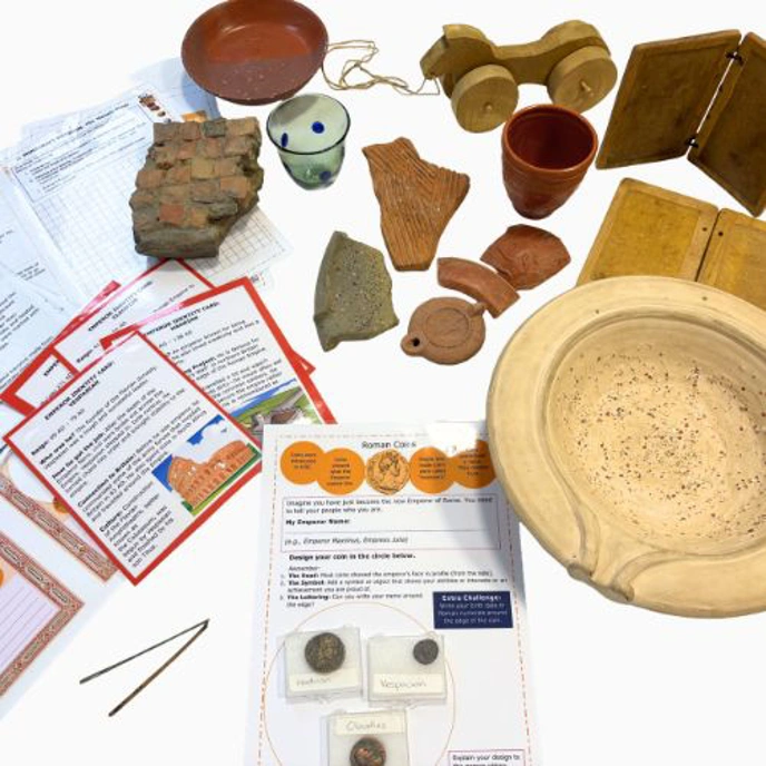 Collection of replica Roman items, including pottery shardss