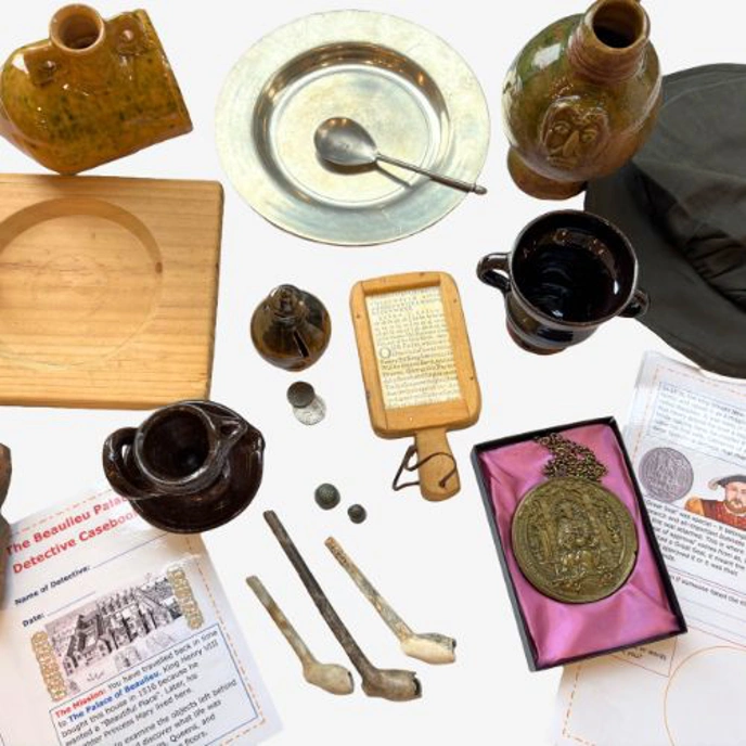 Collection of replica Tudor items, including pipes and jugs