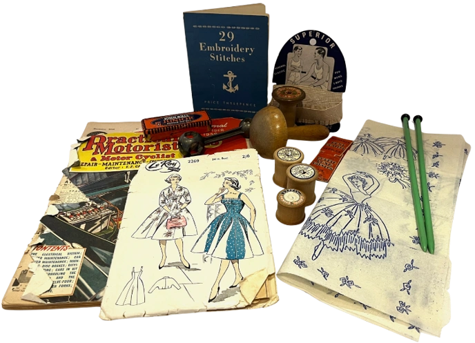 Collection of vintage sewing patterns and other related objects